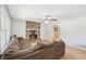 Living room featuring a stone fireplace and a comfortable sectional sofa at 3388 Hamilton Mill Rd, Buford, GA 30519