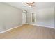 Living area with exterior door, wood-look floors, and view of the bathroom at 3388 Hamilton Mill Rd, Buford, GA 30519