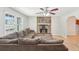 Bright living room featuring a stone fireplace and a comfortable sectional sofa at 3388 Hamilton Mill Rd, Buford, GA 30519