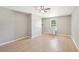 Living area with light wood-look floors, a window, and modern fixtures at 3388 Hamilton Mill Rd, Buford, GA 30519
