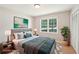 Well-decorated main bedroom featuring a comfortable bed, stylish decor, and a bright window at 3388 Hamilton Mill Rd, Buford, GA 30519