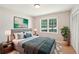 Well-decorated main bedroom featuring a comfortable bed, stylish decor, and a bright window at 3388 Hamilton Mill Rd, Buford, GA 30519