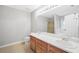 Bathroom featuring a double vanity and a framed mirror with a combination bathtub and shower at 360 N Oakland Circle, Mcdonough, GA 30253