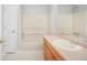 Bathroom featuring a vanity, mirror, tub with shower, and a tile floor at 360 N Oakland Circle, Mcdonough, GA 30253