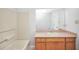 Bathroom featuring a vanity, mirror, tub with shower, and a tile floor at 360 N Oakland Circle, Mcdonough, GA 30253