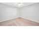 Bedroom with light-colored walls, carpet, a ceiling fan, and a window at 360 N Oakland Circle, Mcdonough, GA 30253