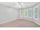 Bedroom with light-colored walls, carpet, a ceiling fan, and windows at 360 N Oakland Circle, Mcdonough, GA 30253