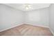 Simple bedroom with neutral carpet and a ceiling fan at 360 N Oakland Circle, Mcdonough, GA 30253