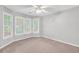 Bedroom with light-colored walls, carpet, a ceiling fan, and windows at 360 N Oakland Circle, Mcdonough, GA 30253