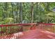 Exterior elevated view from a wooden deck overlooking the wooded backyard at 360 N Oakland Circle, Mcdonough, GA 30253