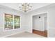 Bright dining area with large windows and an elegant chandelier at 360 N Oakland Circle, Mcdonough, GA 30253