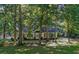 Beautiful ranch-style home with lush green lawn and mature trees, providing shade and privacy at 360 N Oakland Circle, Mcdonough, GA 30253