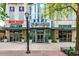 Inviting entrance to Spire building with Five Guys restaurant and well-maintained landscaping at 860 Peachtree Ne St # 1613, Atlanta, GA 30308