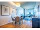 Dining area with modern lighting and views of the city skyline from large windows at 860 Peachtree Ne St # 1613, Atlanta, GA 30308