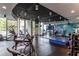 Well-equipped gym with cardio machines, weights, and floor-to-ceiling windows with city views at 860 Peachtree Ne St # 1613, Atlanta, GA 30308