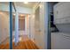 Hallway with washer/dryer closet, view of the ensuite bathroom, and mirrored closet doors at 860 Peachtree Ne St # 1613, Atlanta, GA 30308