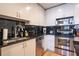 Modern kitchen with black backsplash, stainless steel appliances, and granite countertops at 860 Peachtree Ne St # 1613, Atlanta, GA 30308
