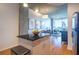 Bright kitchen with hardwood floors, black granite countertops, and an island with a stainless steel trash can at 860 Peachtree Ne St # 1613, Atlanta, GA 30308