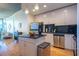 Modern kitchen featuring sleek white cabinets, stainless steel appliances, and black subway tile backsplash at 860 Peachtree Ne St # 1613, Atlanta, GA 30308