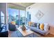 Cozy living room with modern decor and stunning cityscape views from the balcony at 860 Peachtree Ne St # 1613, Atlanta, GA 30308