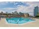 Rooftop pool with lounge chairs overlooks the city skyline on a sunny day at 860 Peachtree Ne St # 1613, Atlanta, GA 30308