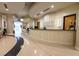 Bright reception area featuring a custom desk, columns, and patterned floors at 860 Peachtree Ne St # 1613, Atlanta, GA 30308