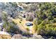 Aerial view showcasing the house nestled among mature trees on a private lot surrounded by nature at 280 Hitchcock Rd, Dallas, GA 30157