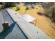 Aerial view of roof and covered porch with natural light shining onto the wooden flooring in the backyard at 280 Hitchcock Rd, Dallas, GA 30157