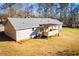 Aerial view of home featuring a covered deck, siding, roof, and expansive yard in a lush, wooded setting at 280 Hitchcock Rd, Dallas, GA 30157