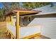Back porch with covered roof and railings and view of home siding with door and window features at 280 Hitchcock Rd, Dallas, GA 30157