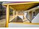 The covered back porch is a great place to relax and enjoy the view of the backyard with its wooden floors at 280 Hitchcock Rd, Dallas, GA 30157