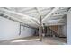 Unfinished basement with exposed beams and white painted walls at 280 Hitchcock Rd, Dallas, GA 30157