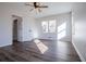 This bedroom offers an abundance of natural light, hardwood floors, and neutral paint at 280 Hitchcock Rd, Dallas, GA 30157