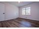 Hardwood floors, ceiling fan and large windows make this room move-in ready at 280 Hitchcock Rd, Dallas, GA 30157