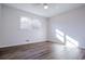 Bedrooom features hardwood floors, ceiling fan and sun-lit windows at 280 Hitchcock Rd, Dallas, GA 30157