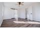This bedroom features a sliding door, ceiling fan, and beautiful wood-look flooring at 280 Hitchcock Rd, Dallas, GA 30157