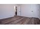 An empty bedroom features hardwood floors, two doors, and baseboard at 280 Hitchcock Rd, Dallas, GA 30157
