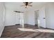 Bright bedroom offers sliding barn door and new wood flooring, with views to other rooms at 280 Hitchcock Rd, Dallas, GA 30157