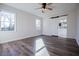Bright bedroom offers sliding barn door to the Primary bath, natural light and new wood flooring at 280 Hitchcock Rd, Dallas, GA 30157