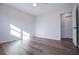 Bedroom features hardwood floors, a ceiling fan, and white trim at 280 Hitchcock Rd, Dallas, GA 30157