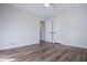 Bright bedroom with hardwood floors, white walls, and ceiling fan at 280 Hitchcock Rd, Dallas, GA 30157