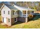 View of a split level home featuring a covered porch and basement garage at 280 Hitchcock Rd, Dallas, GA 30157