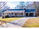 Charming single-story home featuring a covered porch, attached garage, and a well-maintained front yard at 280 Hitchcock Rd, Dallas, GA 30157