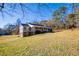 View of the side of a home, including a basement and covered porch at 280 Hitchcock Rd, Dallas, GA 30157