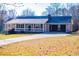 Traditional home on a sunny lot featuring a covered porch and attached garage at 280 Hitchcock Rd, Dallas, GA 30157