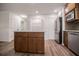 Bright kitchen features shaker cabinets, island with granite countertop, and stainless steel appliances at 280 Hitchcock Rd, Dallas, GA 30157