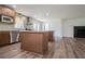 Open concept kitchen with an island, stainless steel appliances, and light walls at 280 Hitchcock Rd, Dallas, GA 30157