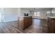 Kitchen island with light walls and hardwood floors at 280 Hitchcock Rd, Dallas, GA 30157