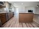 Open concept kitchen with an island, stainless steel appliances, and a fireplace at 280 Hitchcock Rd, Dallas, GA 30157