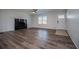 Bright living room with a black fireplace, light walls and hardwood floors at 280 Hitchcock Rd, Dallas, GA 30157